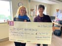 Lynsey Doherty, of Inishowen Rugby Club, presents a cheque for €642.80 to Ruth Garvey-Williams, of Insight Inishowen.