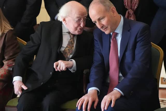 Former President Michael D Higgins with Taoiseach Micheál Martin (Niall Carson/PA)