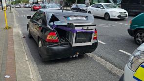 National: Phone-using driver with oven hanging out of the boot has car seized