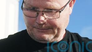 Murder accused cut dressing gown belt so he could hold dead wife, court hears