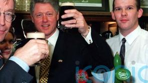 White House did not want photo of Clinton shaking Adams&rsquo; hand during 1995 visit