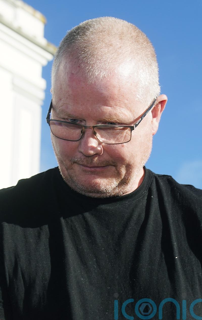 Murder accused cut dressing gown belt so he could hold dead wife, court hears